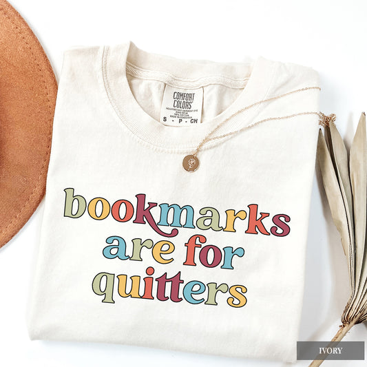 White sweatshirt with colorful text 'bookmarks are for quitters' on a white background