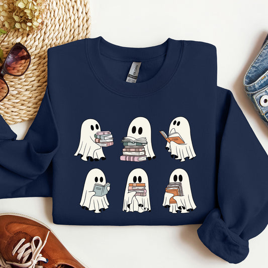 Navy blue sweatshirt with ghost illustrations reading books on a white surface.