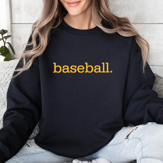 A woman wearing a black sweatshirt with 'baseball.' on it in yellow print.