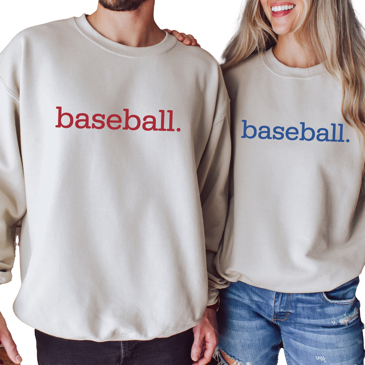 A man and a woman wearing sand sweatshirts with 'baseball.' on them.