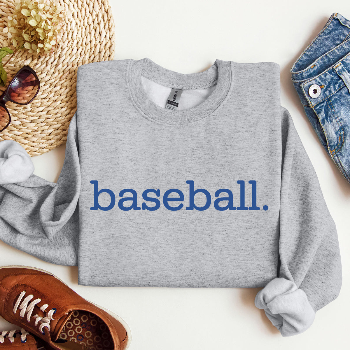 A heather gray sweatshirt with 'baseball.' on it in blue print.