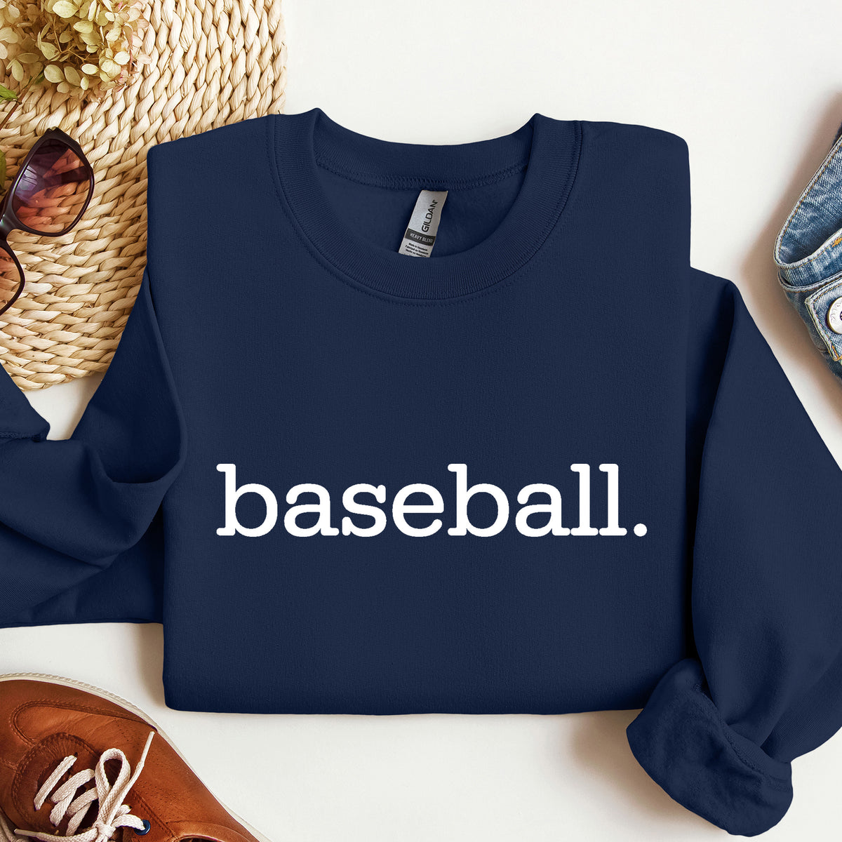 A navy sweatshirt with 'baseball.' on it in white print.