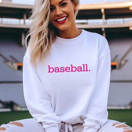 A woman wearing a white sweatshirt with 'baseball.' on it in hot pink print.