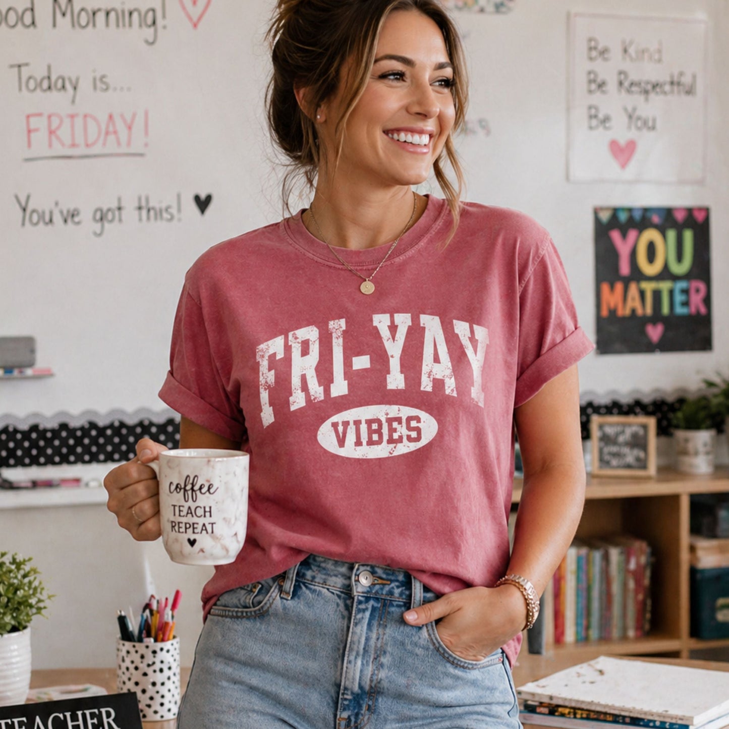Person wearing a 'FRI-YAY VIBES' t-shirt in a classroom setting