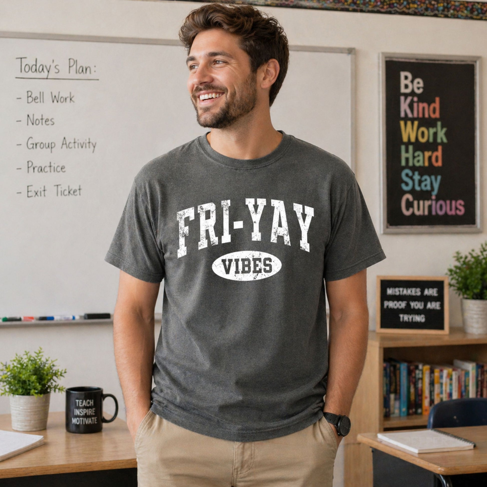 Man wearing a 'FRI-YAY VIBES' t-shirt in a classroom setting
