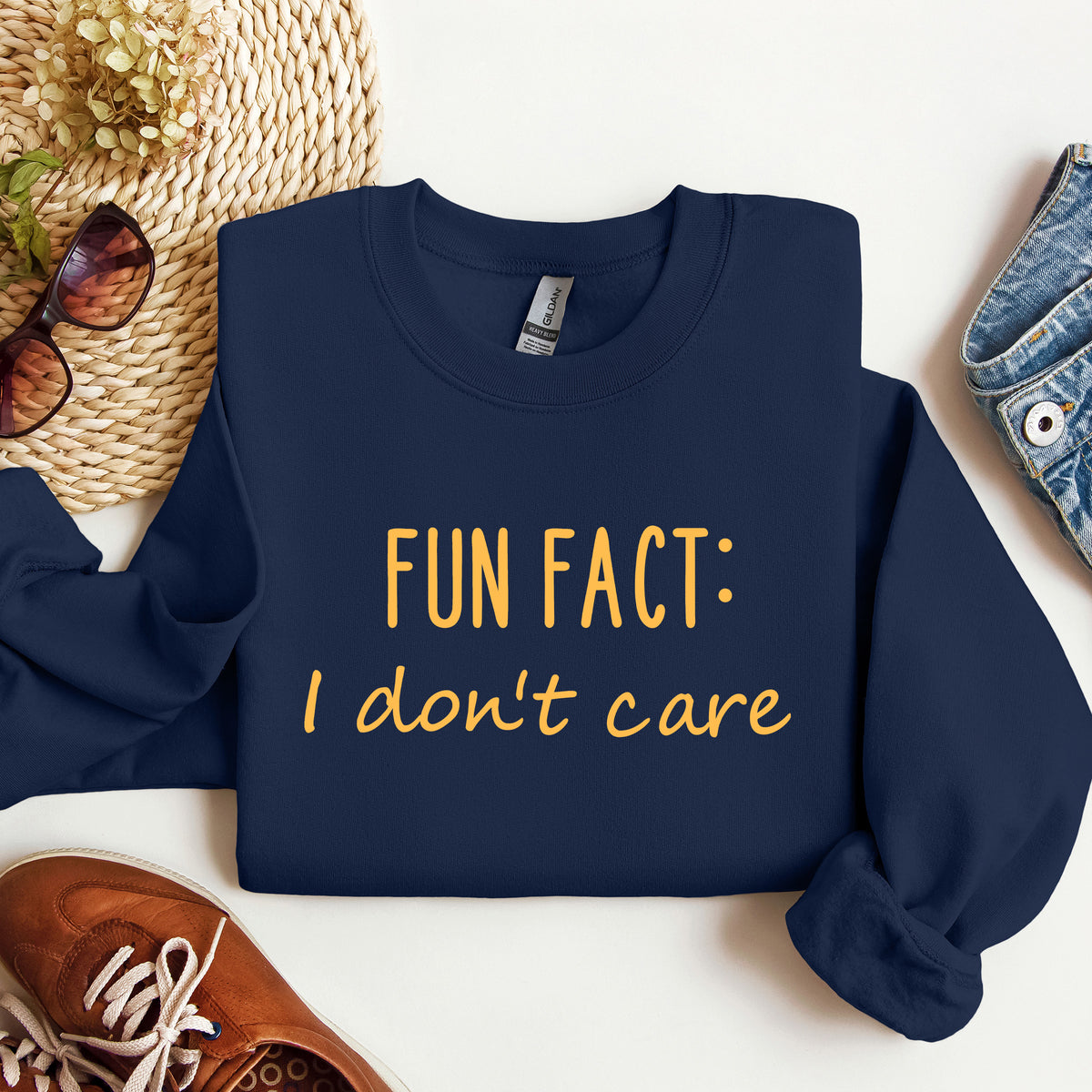 A navy blue sweatshirt that says 'Fun Fact: I don't care' on it.