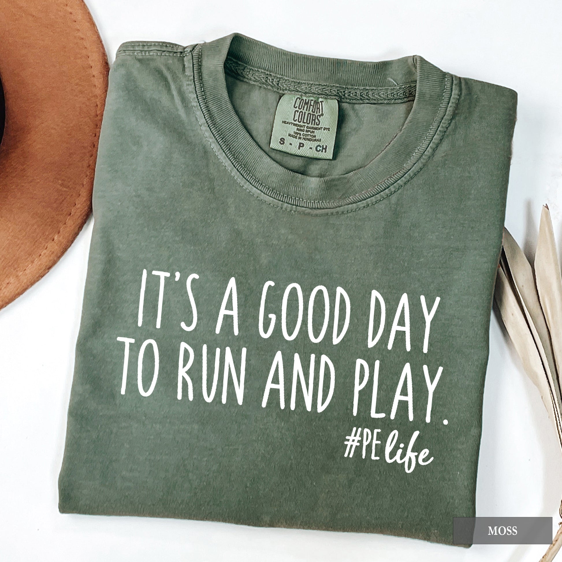 A moss comfort colors shirt that says It's a Good Day to Run and Play #PE life