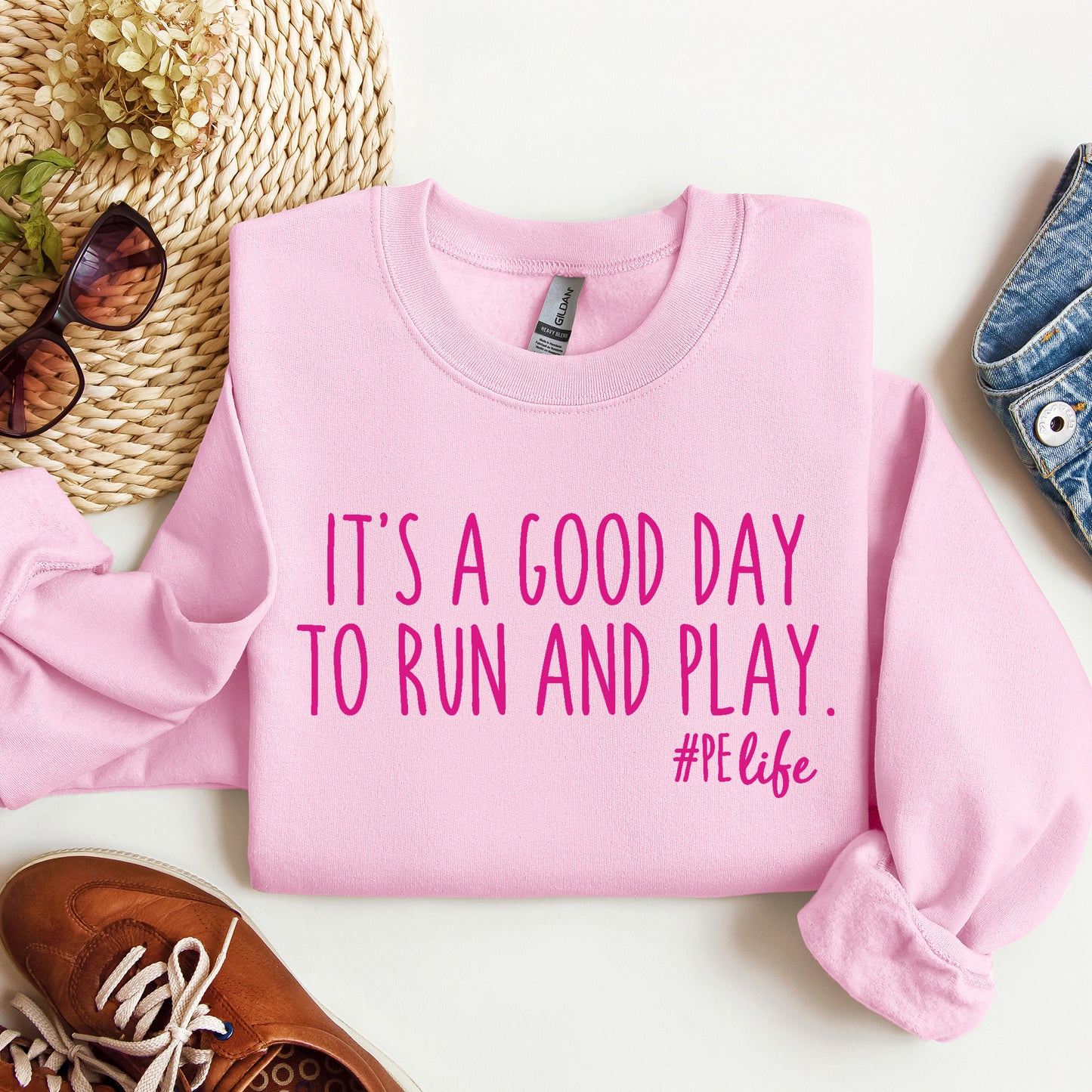 A light pink Gildan sweatshirt that says It's a Good Day to Run and Play #PE life