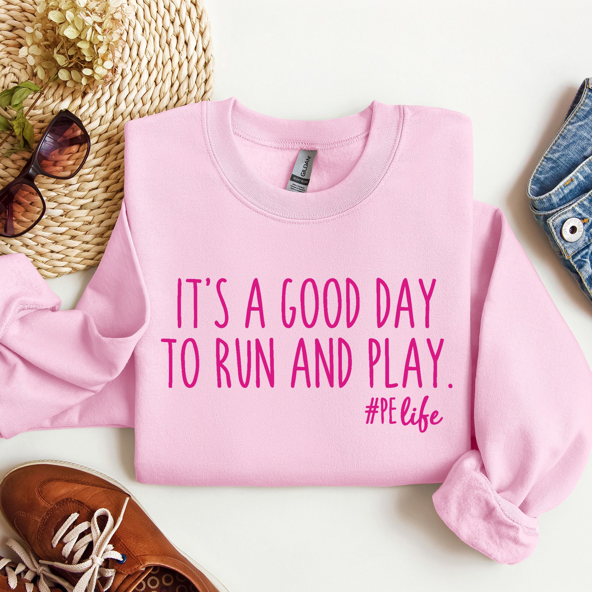 A light pink Gildan sweatshirt that says It's a Good Day to Run and Play #PE life