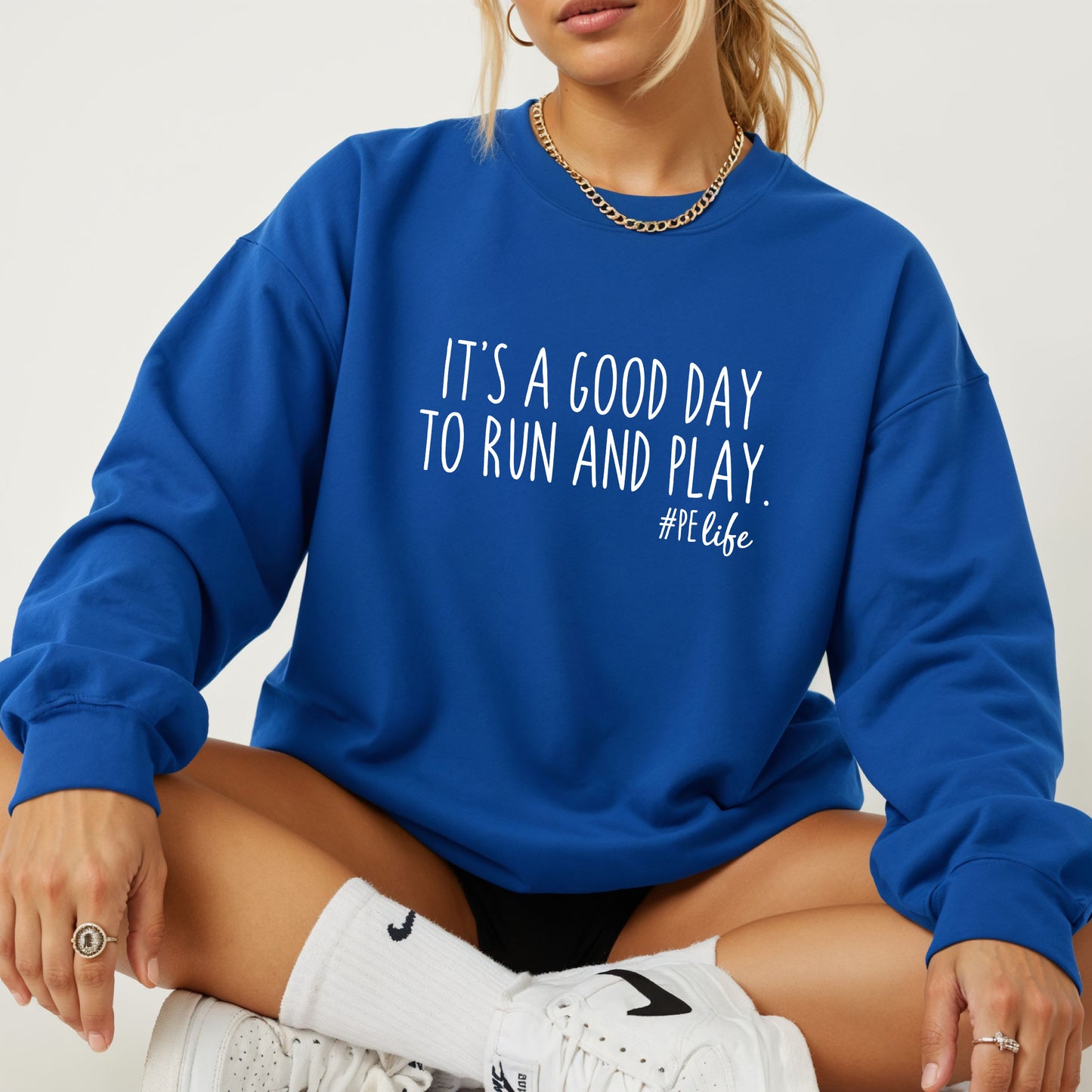 A royal Gildan sweatshirt that says It's a Good Day to Run and Play #PE life