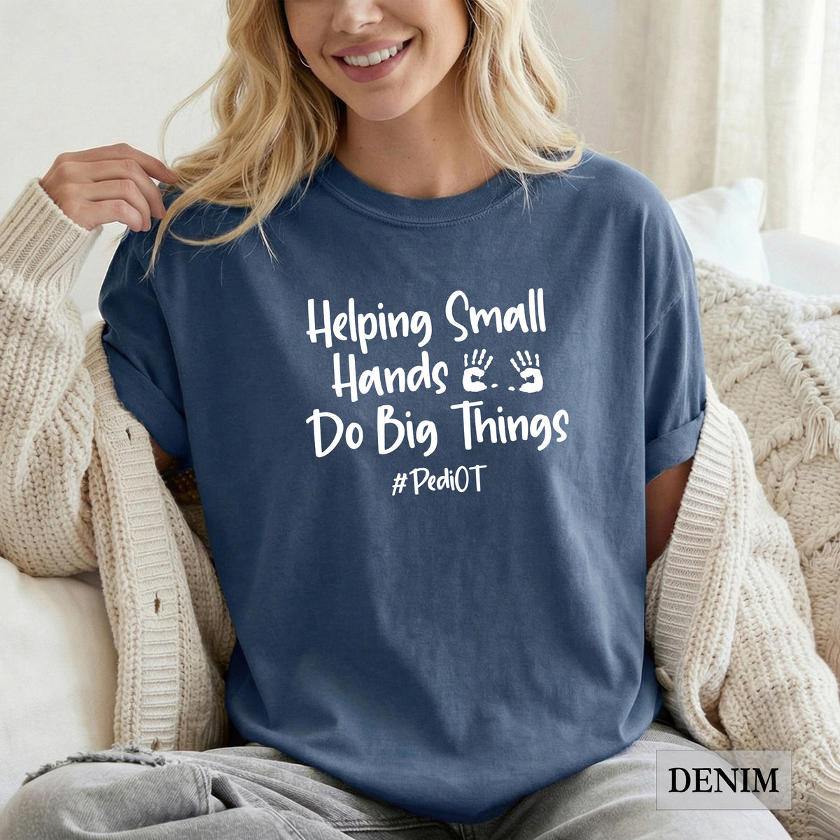 A woman wearing a denim comfort colors shirt that says Helping Small Hands Do Big Things #PediOT