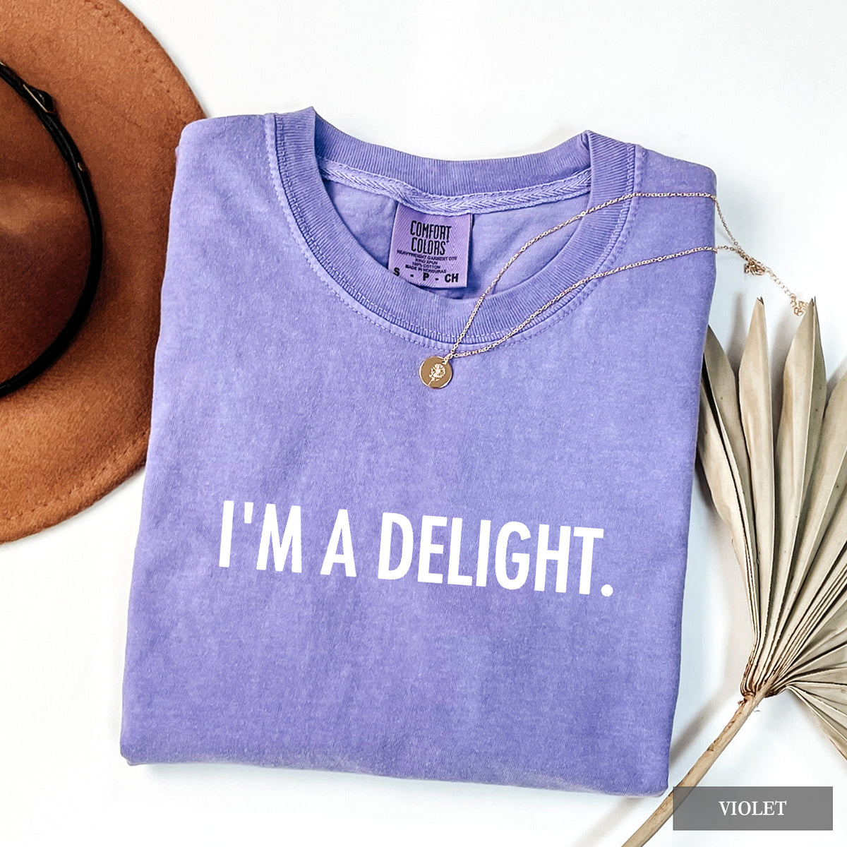 A violet comfort colors shirt with 'I'm a Delight' on it in white print.