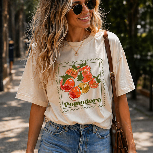 Woman wearing a t-shirt with 'Pomodoro' Tomato Italian design outdoors