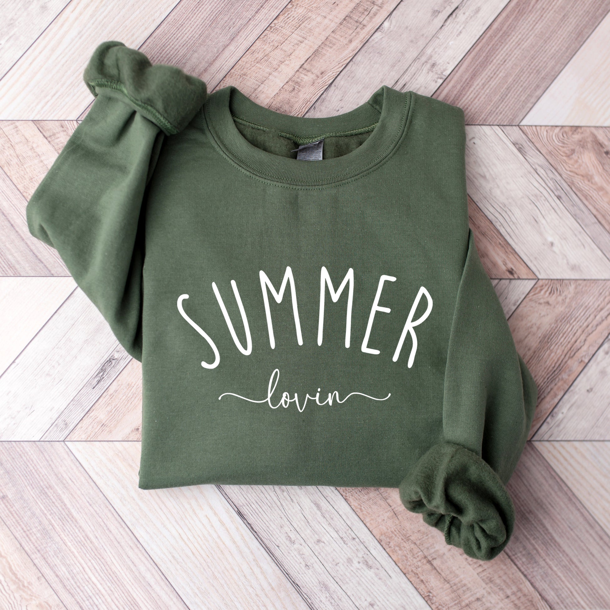 A Military Green Gildan sweatshirt that says Summer Lovin on it.