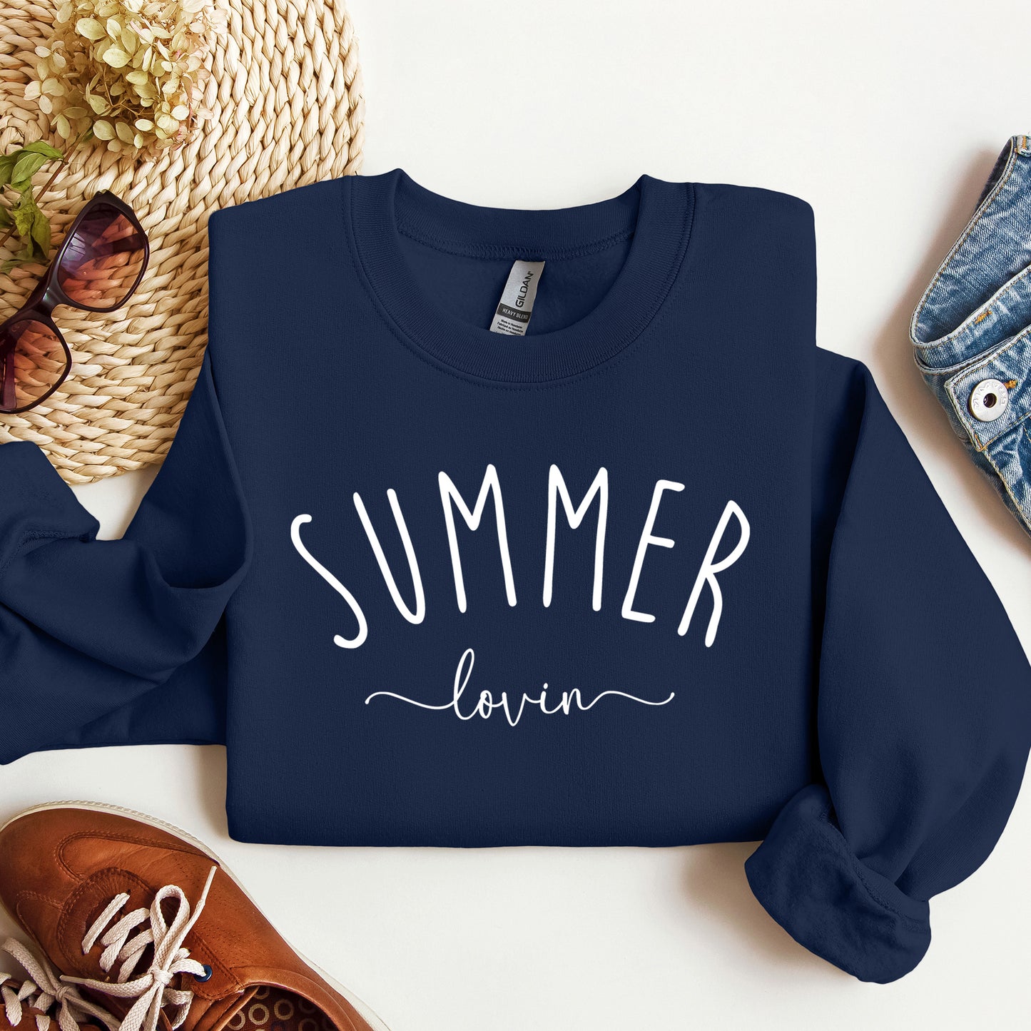 A Navy Gildan sweatshirt that says Summer Lovin on it.