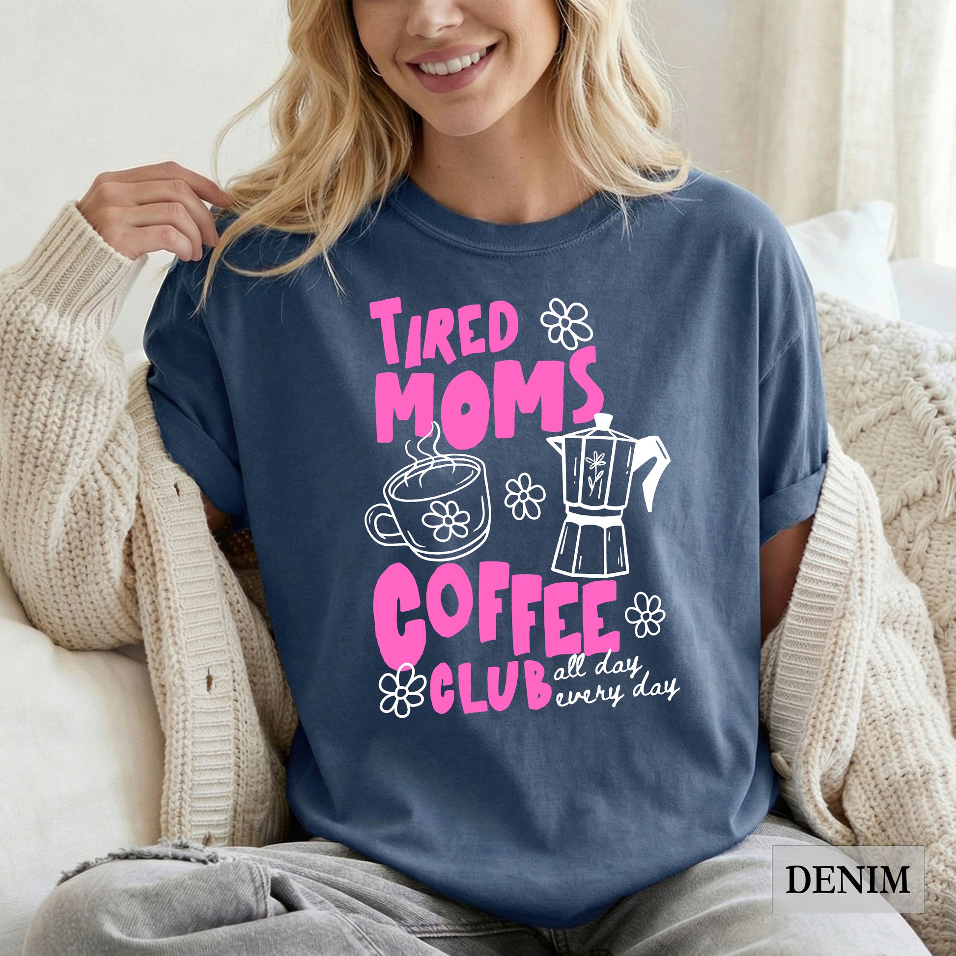 Woman wearing a denim t-shirt with 'Tired Moms Coffee Club' design.