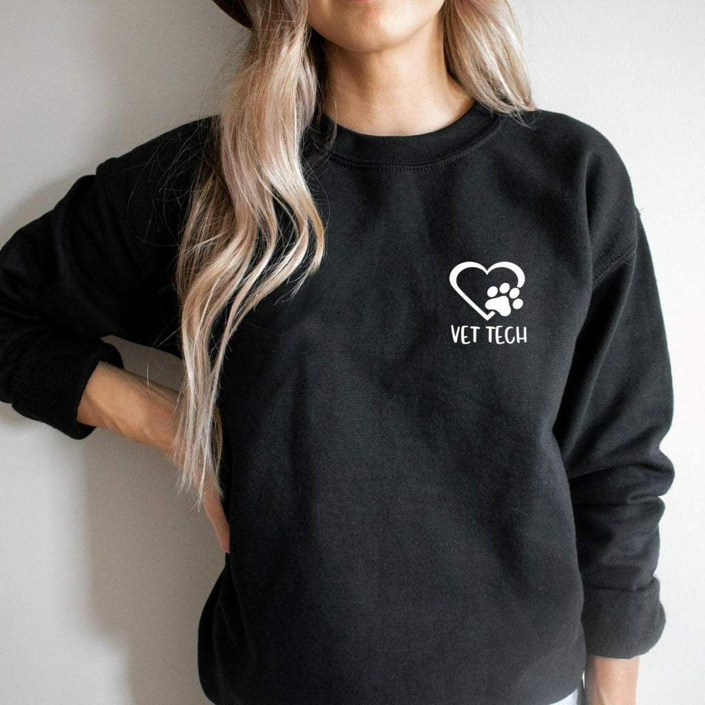vet tech crewneck sweatshirt, pocket vet tech with heart and paw print, matching veterinary office tshirts, veterinarian shirts, vet tech week graphic tee