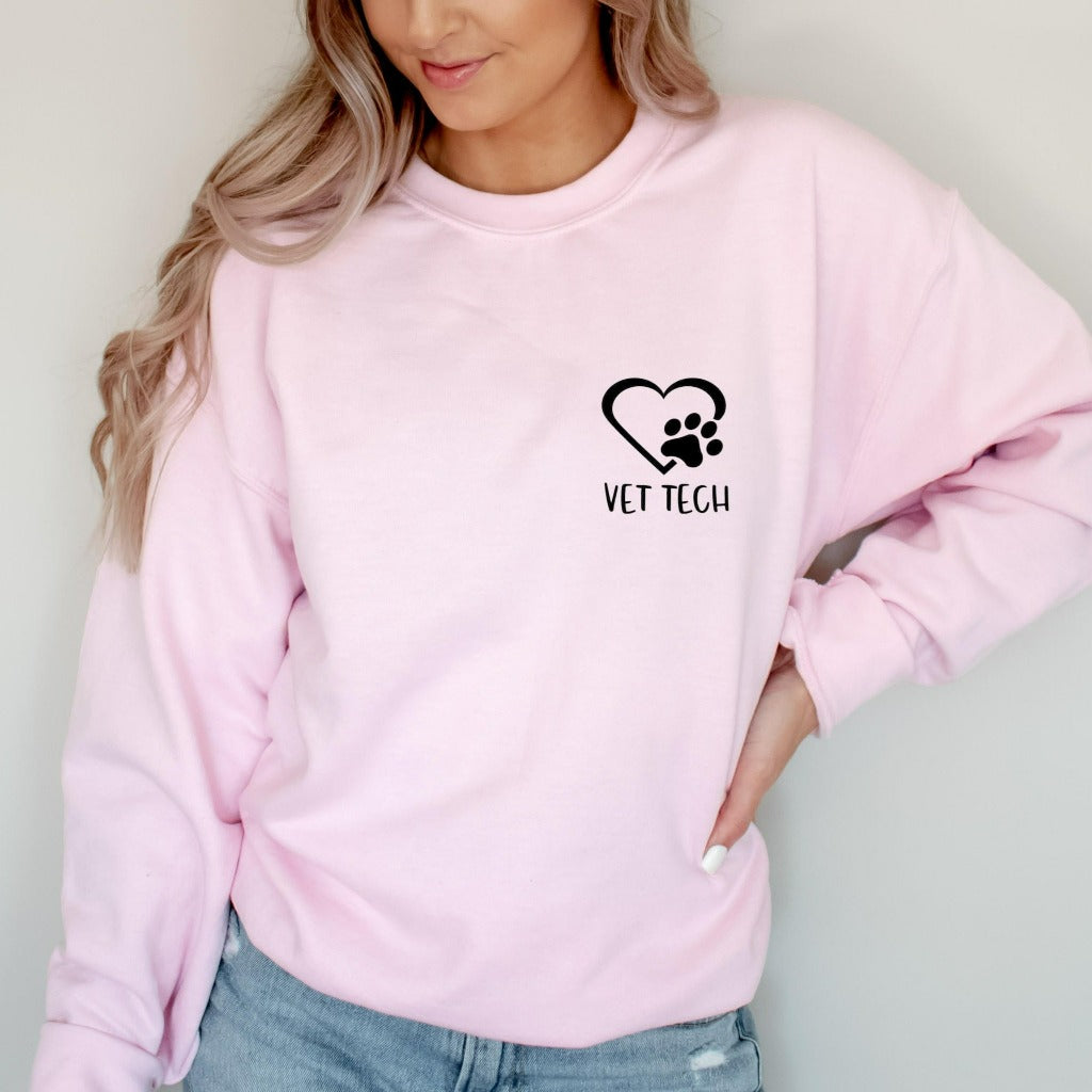 vet tech crewneck sweatshirt, pocket vet tech with heart and paw print, matching veterinary office tshirts, veterinarian shirts, vet tech week graphic tee